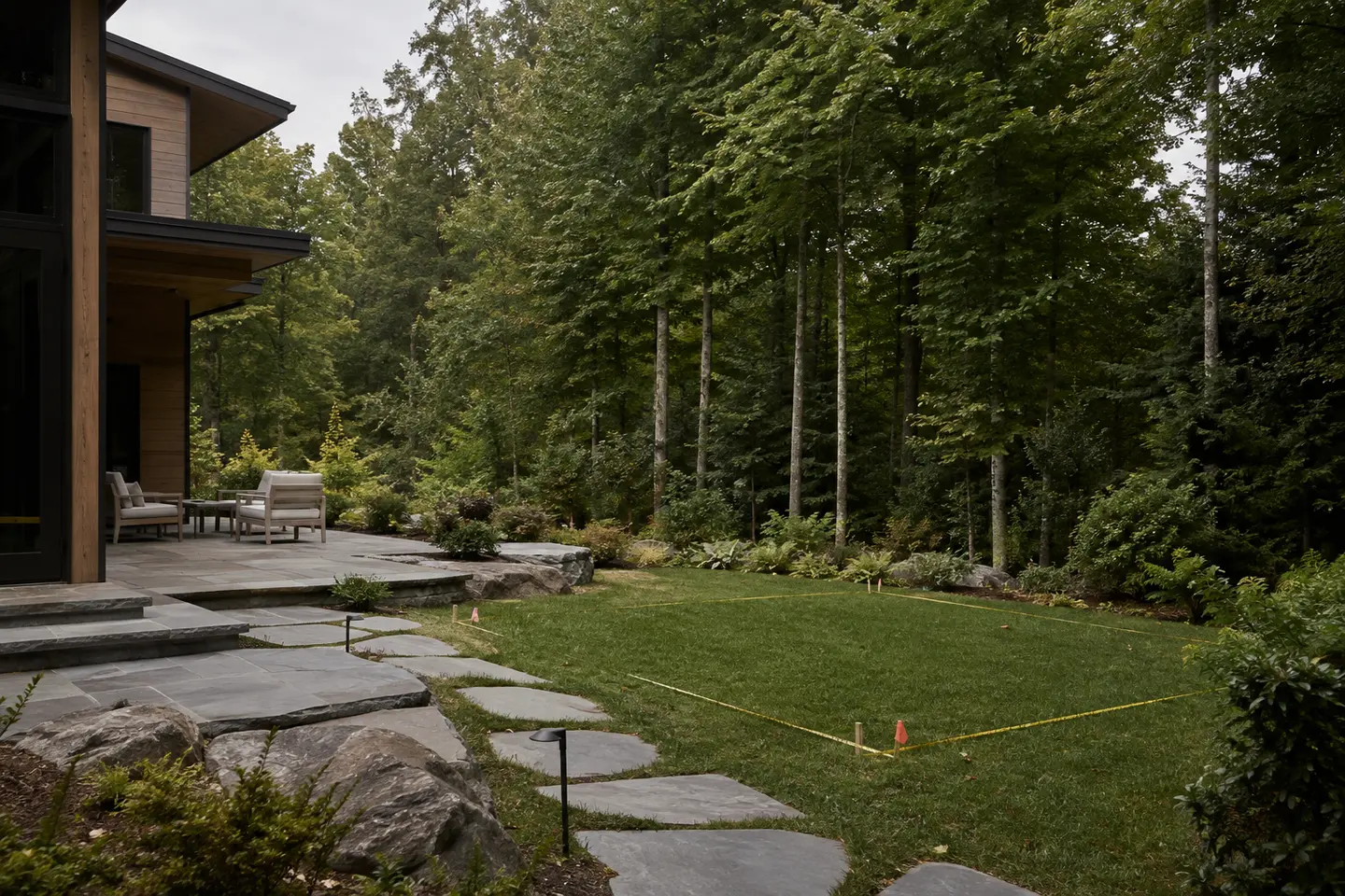 Landscaped residential backyard location marked for site evaluation