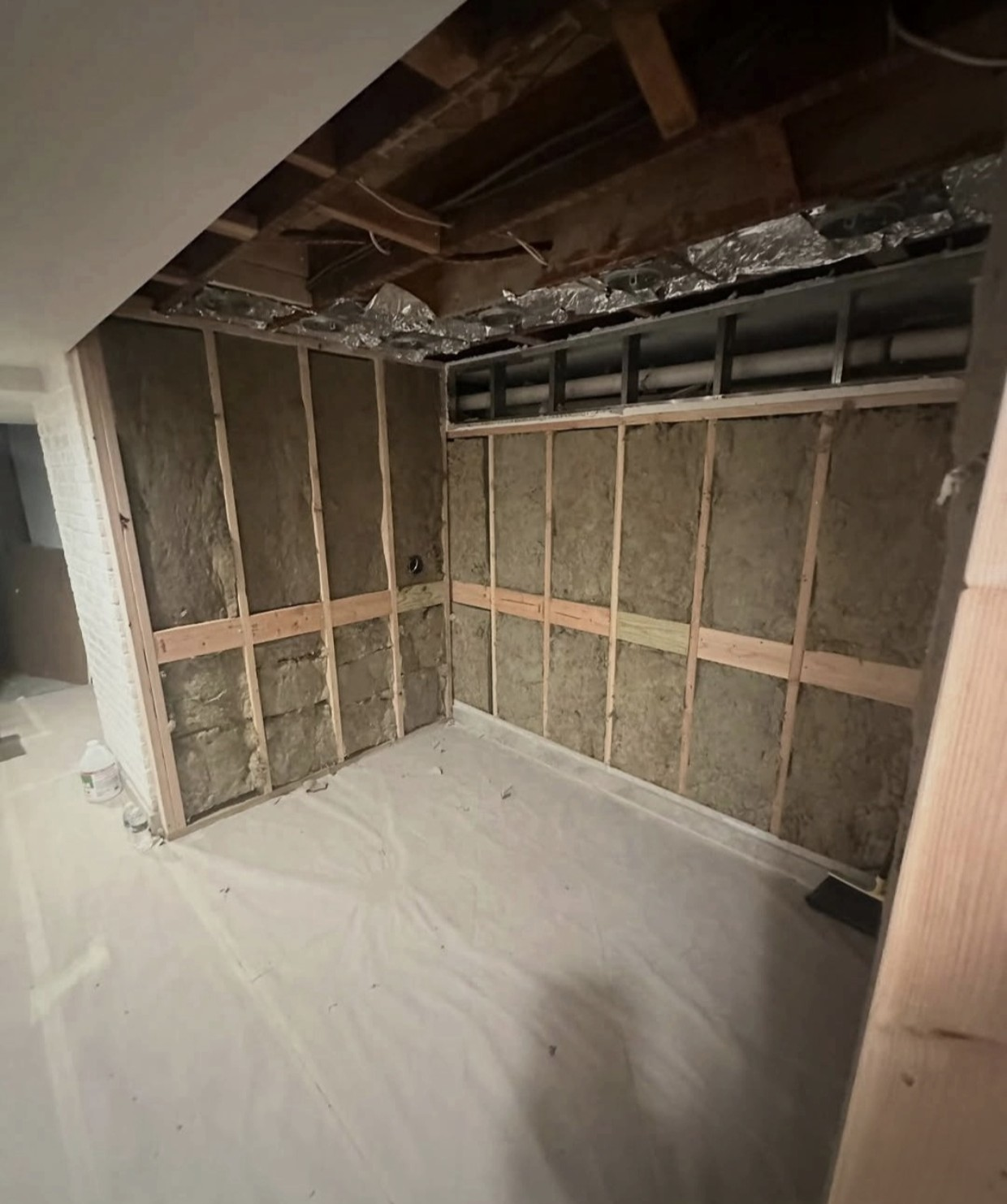 Mineral-wool insulation installed between the wall framing members.