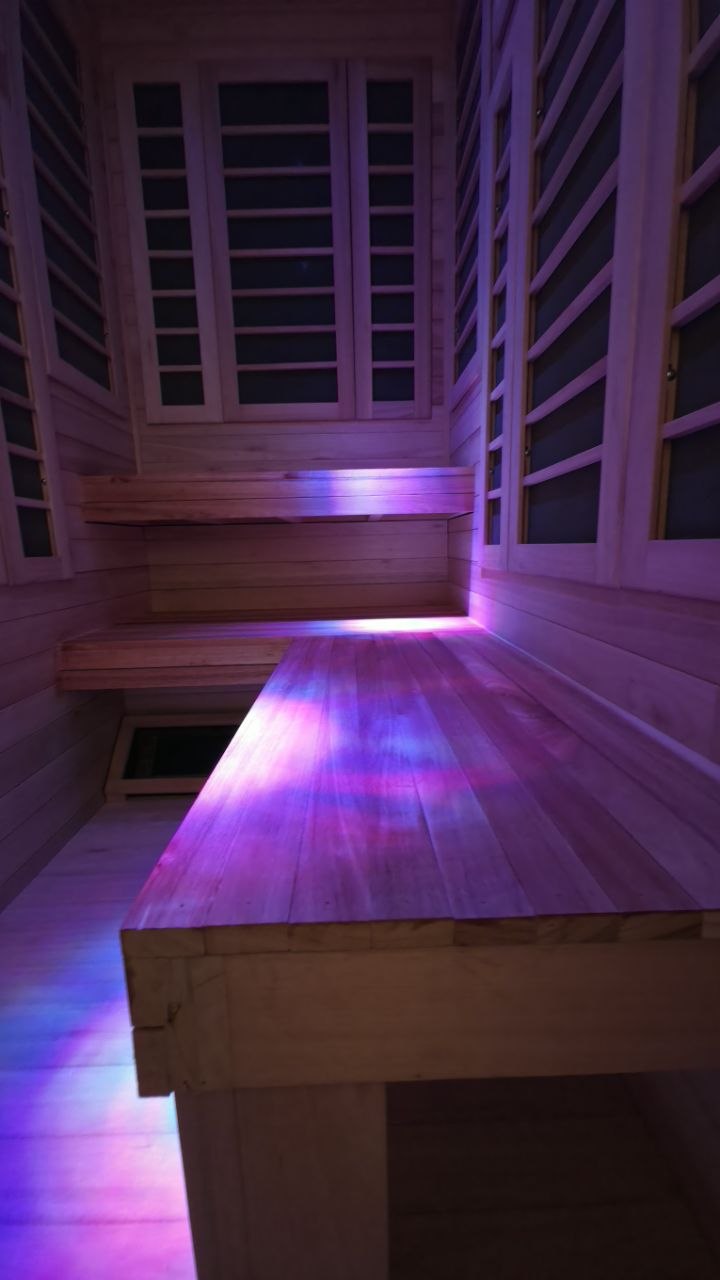 Bench seating and infrared panels in the installed sauna