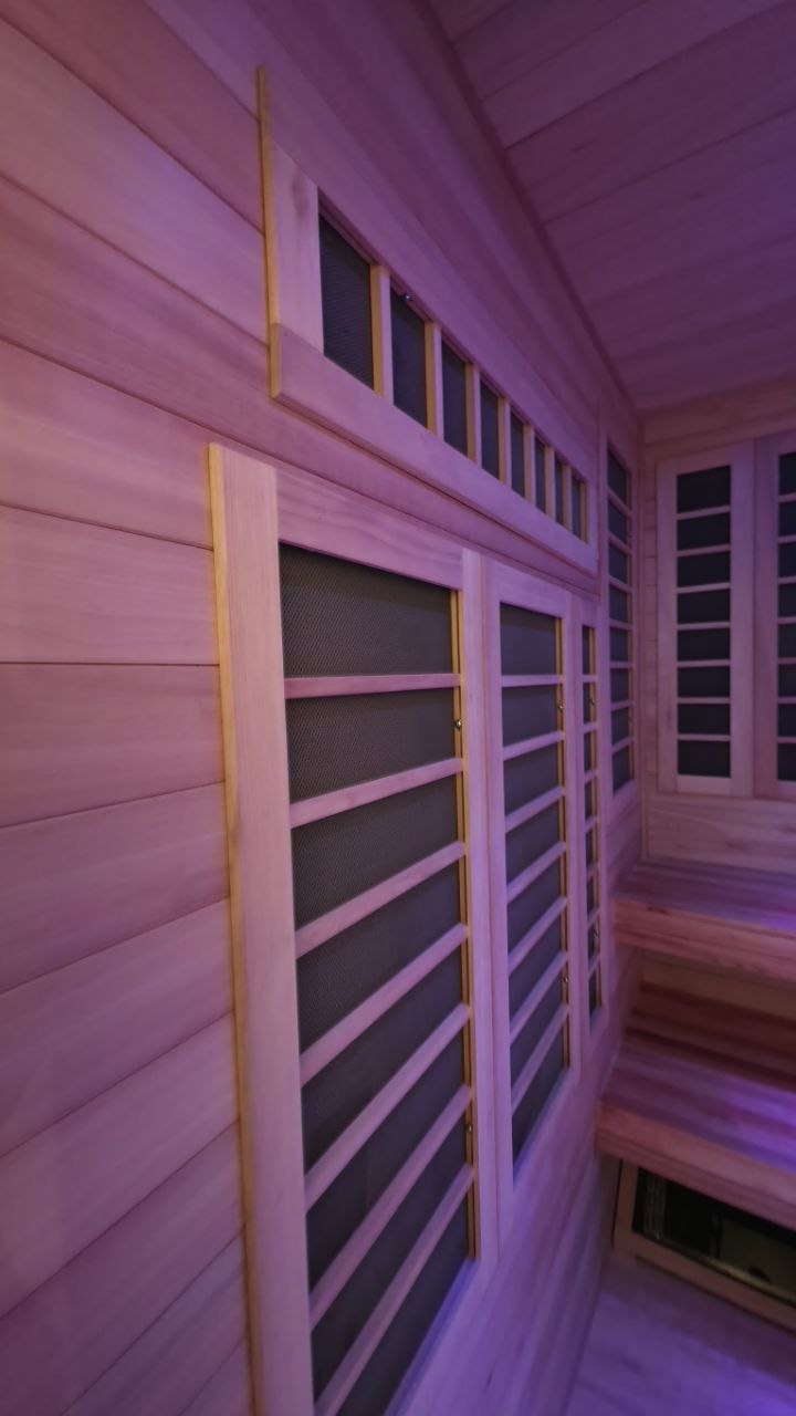 Infrared panel frames integrated into the wood-lined walls