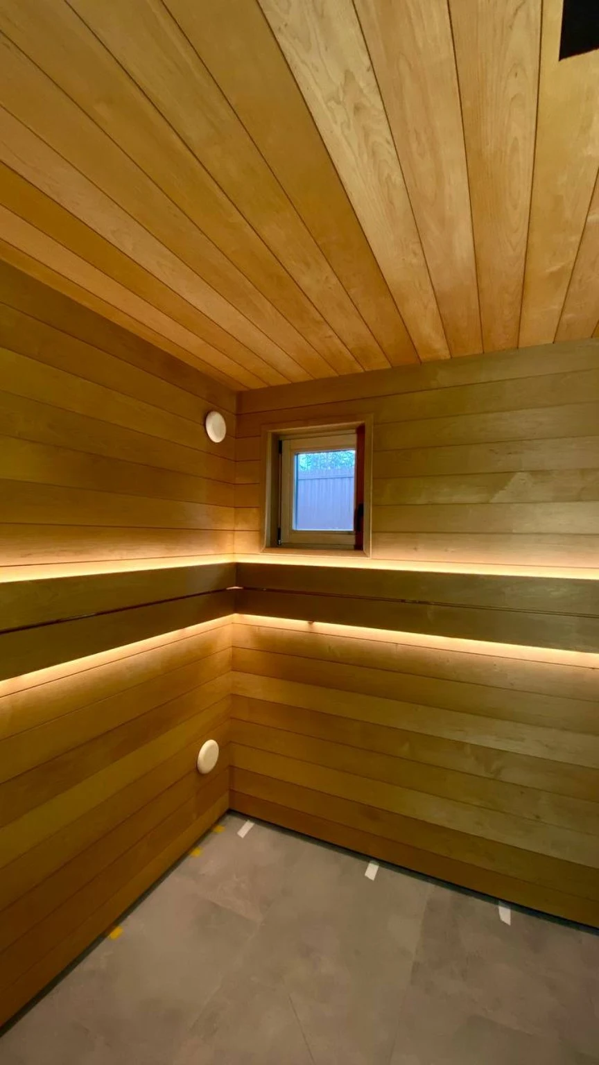 Wall paneling and lighting installed before the benches