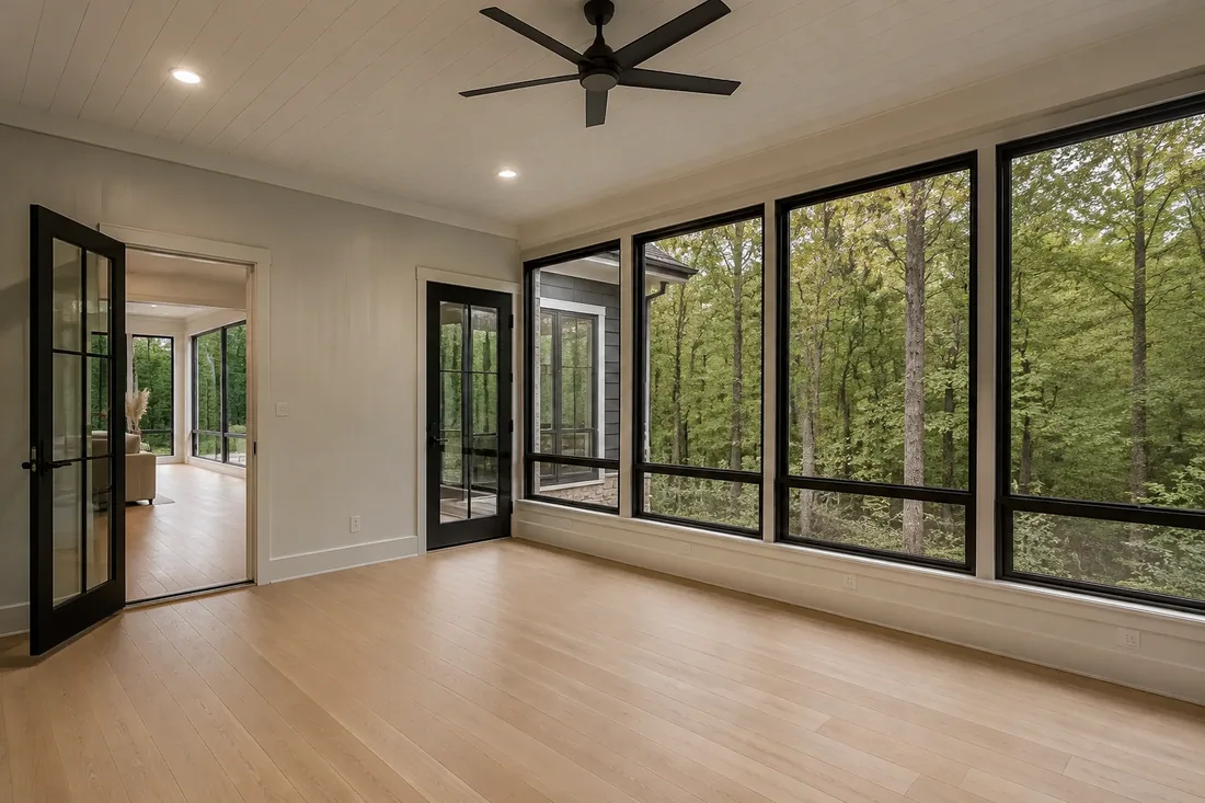 High-end enclosed porch overlooking a green American woodland